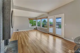 Gleaming hardwoods and XL windows for stunning VIEWS. Doors lead to expansive rear deck