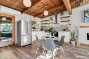 Beautiful great room with original fir vaulted ceilings and waterproof laminate wood plank flooring! Ductless HP for Cooling and Heating! Tankless hot water!