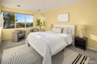 This bedroom enjoys privacy + garden/water views.