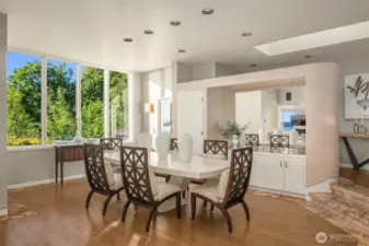 The dining room area opens onto another deck overlooking breathtaking views of Three Tree Point.