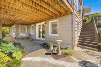 This is the view as you walk up from 59th. Doors to family room and stairs to front door