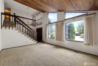 Living room looking toward the entry and upstairs