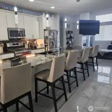 Kitchen displays the 15 foot island, custom lighting and back slash