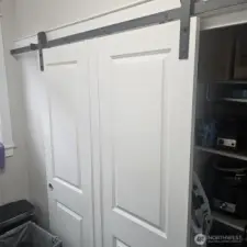 barn door for the pantry in the laundry room
