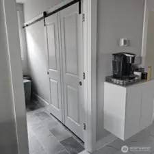 barn door is right behind the laundry door not displayed.