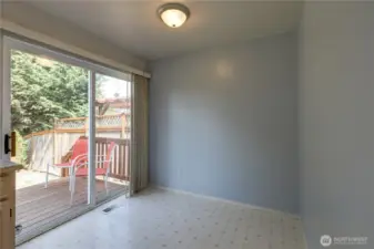 Eating space off of the kitchen that opens to the deck and large private fenced backyard.  Garden space, shed, sitting area patio