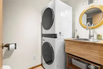 Half bath with new (1 yr.) LG washer and dryer. There is storage space behind the door