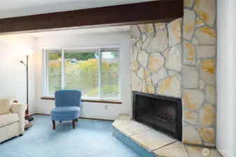 Living area looks out to  yard area with privacy