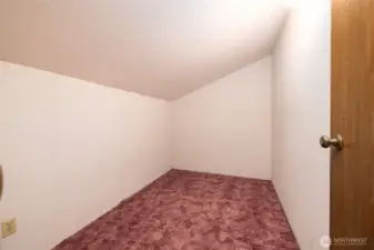 Storage room off full bath on upper level