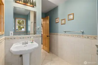 Extensive custom tile work in main floor 3/4 bath.