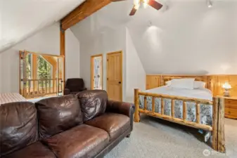 Primary suite offers potential sleeping loft for many guests.