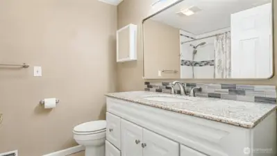 Full sized bathroom across from the guest bedrooms with plenty of counter space and storage.