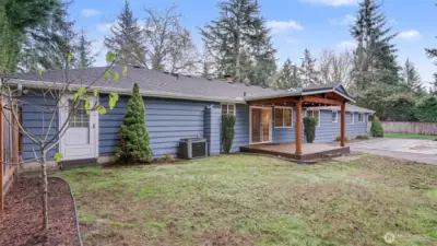 The spacious yard offers room to play, garden, or entertain.