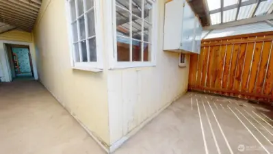 Covered outdoor area off of the kitchen to the breezeway