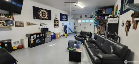 Huge garage with epoxy floors and tons of storage
