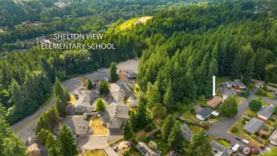 Shelton View Elementary is blocks away! White arrow indicates where the home is