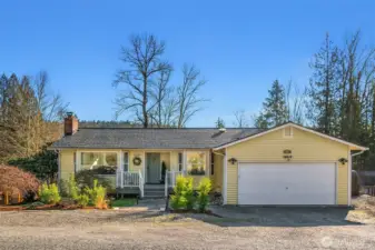 Extensive and thoughtful landscaping frames this truly turn-key home.