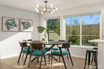 Spacious dining room is bathed in sunlight. New, high quality shades have been installed on all south-facing windows.