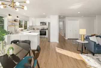 View towards the hallway leading to the primary BR, second BR/office, garage access, & staircase to the lower level.