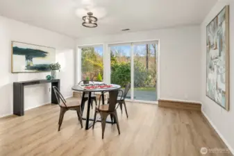 Extended rec room area with direct back yard access.