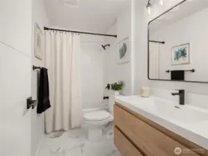 Remodeled full bathroom on the lower level.