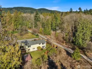 The home is set in the south slope of the "Issaquah Alps," offering peace and transquility.