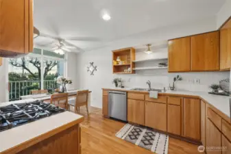 The kitchen has an abundance of solid oak cabinets and lots of counter space. The stainless appliances have been updated.