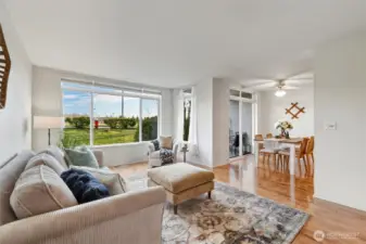 Looking across the living room toward the dining area that opens onto the cover deck.