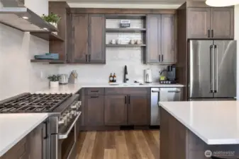The kitchen in the model home. Finishes, cabinetry, appliances may vary.