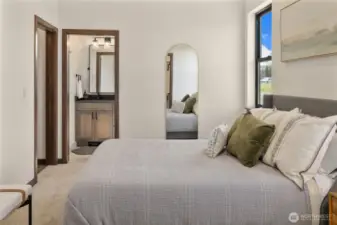 Primary suite, located on the main floor. This photo is of the model home.