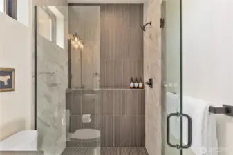 Shower in primary bath. Finishes, fixtures, etc. may vary.
