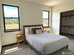 Primary suite, located on the main floor. This photo is of the model home.