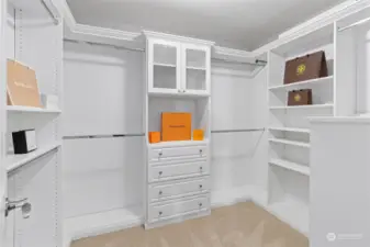 Your walk-in closet has been upgraded with a customized closet system, including a jewelry drawer, sliding belt/tie tracks & shoe racks. This space has been meticulously crafted to keep your wardrobe impeccably organized & easily accessible. The hanging rods & shelves are rearrangeable to adjust to your preferences.