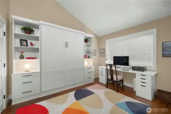 Second bedroom with built-in Murphy bed & custom cabinets.