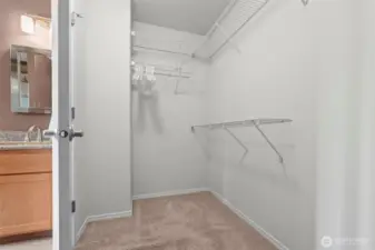 Spacious walk-in closet off of primary bathroom.