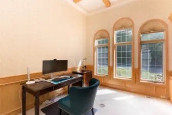 On the main level, a spacious office/library