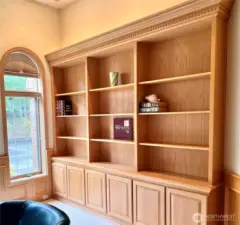 The office/library built-ins across from the desk area