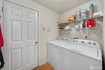 Mudroom/laundry area accesses the garage.