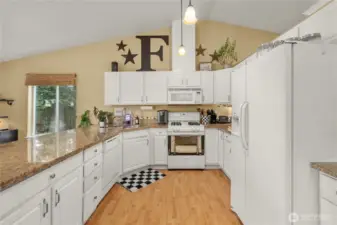 Light and bright open kitchen offer loads of cabinets and counterspace.