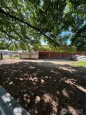 view of one paddock by barn