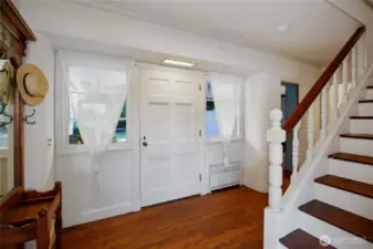 The moment you step inside this home, you're surrounded by custom handcrafted wood finishes and details that never cease to impress. Notice the recessed radiator.  Thoughtful touches like this greet you at every turn.