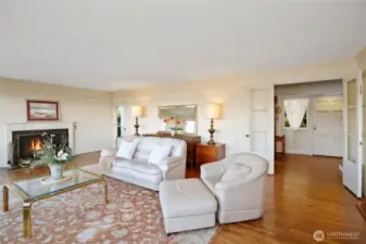 Step into the formal living room with it's grand fireplace.  A wonderful place to entertain your guests.