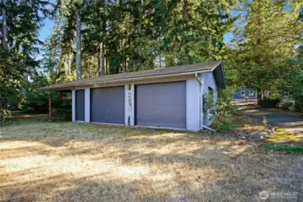 3 car garage/carport.  Perfect to store the boat over winter. This garage was built with trusses, has gas, water, and electric connected or available.  A separate unused septic from a previously existing home means potential conversion to ADU!