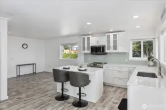 Looking from the French doors and living room area towards the kitchen and dinning room.