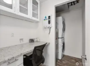 Laundry room with desk/office space.