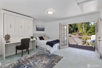 Primary bedroom/loft facing private deck with French doors.