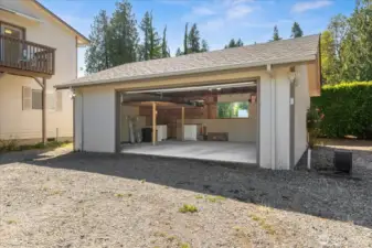 Oversized detached garage with storage loft and shop area.