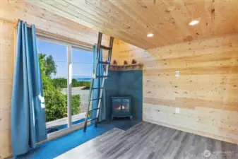 Enjoy the views from the lower level of bunkhouse with electric fireplace.