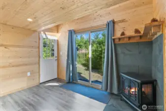 Lower level of bunkhouse with electric fireplace.