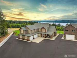 Welcome to Belfair! 5 Acre estate w/ 3 distinct structures - main home, guest home & garage + additional shop.